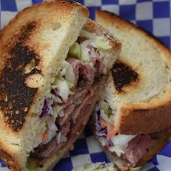 Aryeh's Kitchen - Nashville Twist - Juicy pastrami topped with our famous bourbon slaw on grilled bread