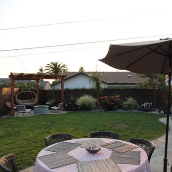 SB Turf & Landscape - a patio with a table and umbrella - Landscaping Near Me - Santa Barbara, California