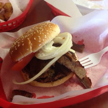 Herm's Palace - Herm's Palace's very own Gyro Burger. A standard burger but topped with lamb, tzatziki, onions, & large tomato slices. - American Near Me - Skokie, Illinois Herm's Palace - Herm's Palace's very own Gyro Burger. A standard burger but topped with lamb, tzatziki, onions, & large tomato slices. - American Near Me - Skokie, Illinois