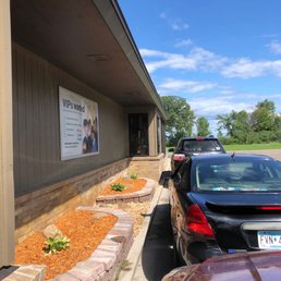 cars parked in front of a restaurant