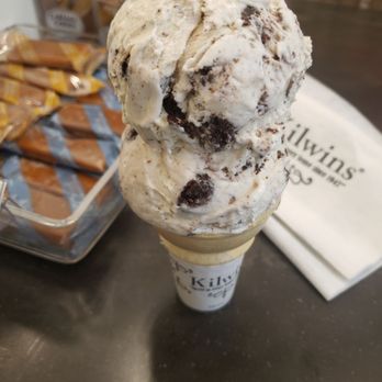 Kilwins Ice Cream - Chocolate - Fudge - 2 scoops of cookies N cream on a cake cone - Chocolatiers & Shops Near Me - Indianapolis, Indiana Kilwins Ice Cream - Chocolate - Fudge - 2 scoops of cookies N cream on a cake cone - Chocolatiers & Shops Near Me - Indianapolis, Indiana