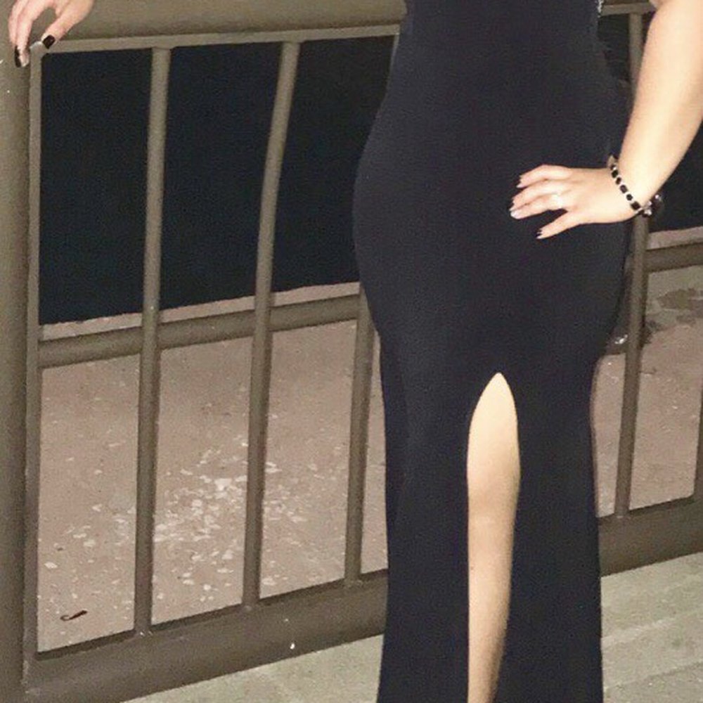 She created an opening on this dress and adjusted the size. She created an opening on this dress and adjusted the size.