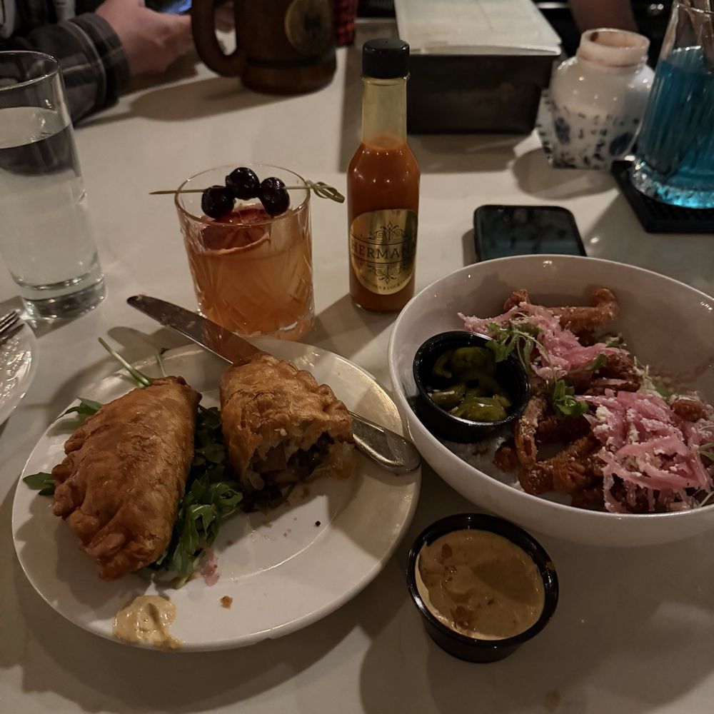 Hermanas Kitchen and Cocktails - Truffle mushroom empanadas and fries - Cocktail Bars Near Me - Lindenhurst, New York Hermanas Kitchen and Cocktails - Truffle mushroom empanadas and fries - Cocktail Bars Near Me - Lindenhurst, New York