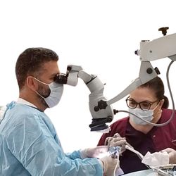Dentistry by Dr. Doshi - Dr T. using Microscope for Endodontic procedures.
