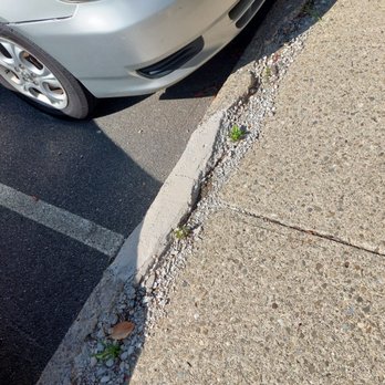Associa New York - Cracked & crumbling curb - Property Management Near Me - Fishkill, New York