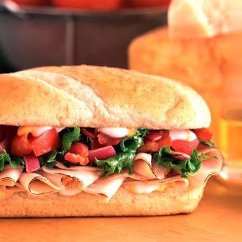 Round Table Pizza - Ham Club Sandwich. Filled with bacon, red onions, three cheeses, lettuce, roma tomatoes and creamy ranch sauce on our freshly baked bread. - Pizza Near Me - Hanford, California Round Table Pizza - Ham Club Sandwich. Filled with bacon, red onions, three cheeses, lettuce, roma tomatoes and creamy ranch sauce on our freshly baked bread. - Pizza Near Me - Hanford, California
