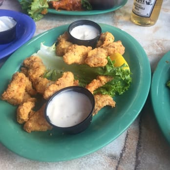 Caroline's - Fried dolphin (mahi mahi) - with a few already snagged off the plate! Scrumptious! - American Near Me - Key West, Florida