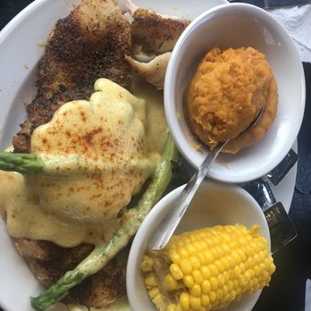 Roosterfish Grill - Grouper with a crab cake, hollandaise sauce, asparagus, mashed sweet potatoes and corn in the cob. A large portion & delicious. - Seafood Near Me - Largo, Florida Roosterfish Grill - Grouper with a crab cake, hollandaise sauce, asparagus, mashed sweet potatoes and corn in the cob. A large portion & delicious. - Seafood Near Me - Largo, Florida