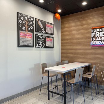 Dunkin - a table and chairs in a coffee shop - Donuts Near Me - Buffalo, New York Dunkin - a table and chairs in a coffee shop - Donuts Near Me - Buffalo, New York