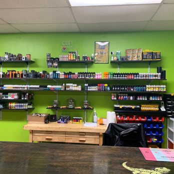 Izzy's Vapors - This is the wall of their products. No that's not weed it's hemp. - Vape Shops Near Me - League City, Texas