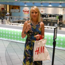 a woman in a dress holding a cell phone