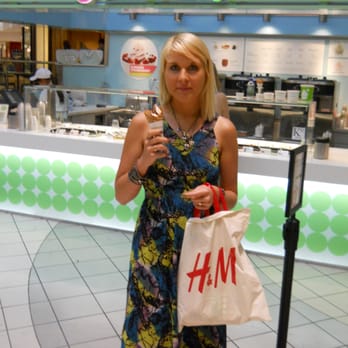 Pinkberry - a woman in a dress holding a cell phone - Ice Cream & Frozen Yogurt Near Me - Ann Arbor, Michigan