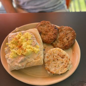 Snooze, an A.M. Eatery - Scrambled eggs over breakfast potpie with sausage & hash browns. - Breakfast & Brunch Near Me - Austin, Texas