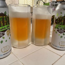 three cans of beer on a counter three cans of beer on a counter