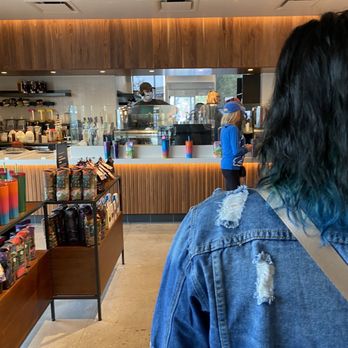 Starbucks - a woman standing in a coffee shop - Coffee & Tea Near Me - Waterford, Michigan Starbucks - a woman standing in a coffee shop - Coffee & Tea Near Me - Waterford, Michigan