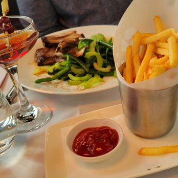 The Mark Restaurant - Foregrounding that side of fries for the table to share - French Near Me - New York, New York