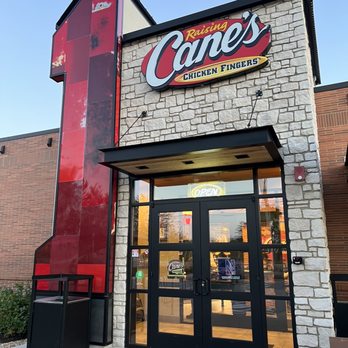 Raising Cane's Chicken Fingers - the front of the building - Fast Food Near Me - Schaumburg, Illinois Raising Cane's Chicken Fingers - the front of the building - Fast Food Near Me - Schaumburg, Illinois
