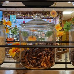 Popeyes Louisiana Kitchen - Glass canisters make up the decorative room divider