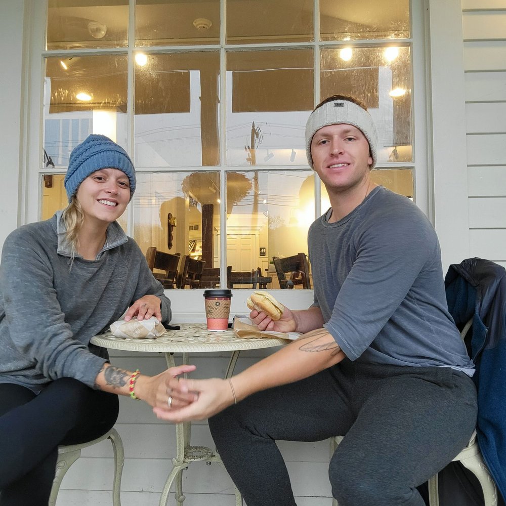 Us sitting outside eating The Admiral (even though the owner keeps accusing us of not being customers)
