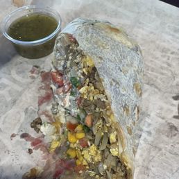 Breakfast burrito with a lot of toppings