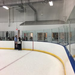 Scott Rakow Youth Center - Rental area behind the glass. $5.00 for rentals and 2 hour skate time...but the ice was so hacked...you easily trip and fall with the holes.