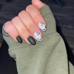 Dark evergreen (forgot the brand) with spring design on OPI funny bunny! Matte top coat on all nails. Nails done by May! Dark evergreen (forgot the brand) with spring design on OPI funny bunny! Matte top coat on all nails. Nails done by May!