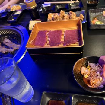 Wagyu Grill AYCE - Salad bar goodies, wagyu, and pork belly on the grill. The popcorn chicken and salmon sashimi. - Japanese Near Me - Milpitas, California