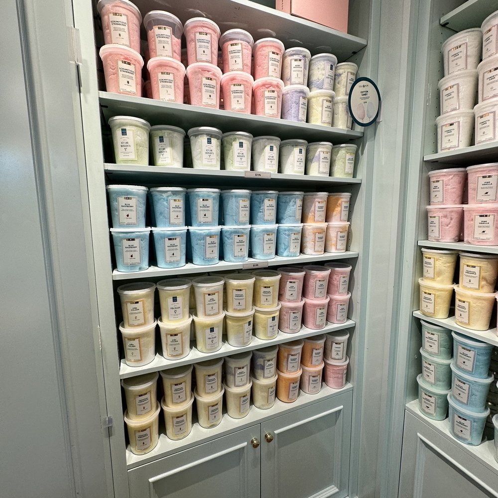 a shelf full of ice creams a shelf full of ice creams