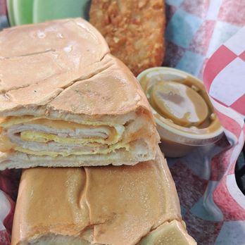 Southernmost Sandy’s Cafe - BIG breakfast sandwich delicious egg cheese and turkey - Food Trucks Near Me - Key West, Florida Southernmost Sandy’s Cafe - BIG breakfast sandwich delicious egg cheese and turkey - Food Trucks Near Me - Key West, Florida
