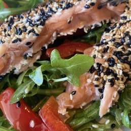 Raw salmon in the salad. Cold inside, very much not cooked Raw salmon in the salad. Cold inside, very much not cooked