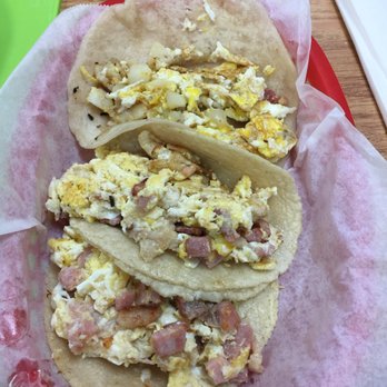 Red Salsa Tacos & More - Top to bottom. One Potato and egg on flour. Two bacon and egg on corn - Mexican Near Me - Spring, Texas Red Salsa Tacos & More - Top to bottom. One Potato and egg on flour. Two bacon and egg on corn - Mexican Near Me - Spring, Texas