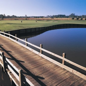 Crow Creek Golf Club - a wooden bridge over a pond - Golf Near Me - Calabash, North Carolina Crow Creek Golf Club - a wooden bridge over a pond - Golf Near Me - Calabash, North Carolina