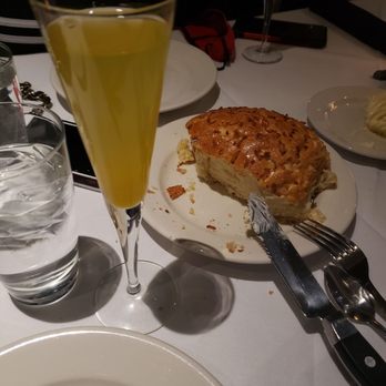 Morton's The Steakhouse - Crusty bread, whipped butter and a Mango Bellini - Steakhouses Near Me - New York, New York