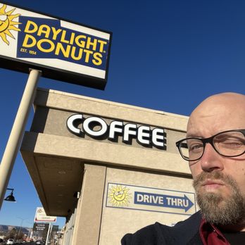 Daylight Donuts - a man standing in front of a coffee shop - Donuts Near Me - Grand Junction, Colorado