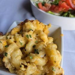 Morgan's - Very rich Mac n cheese. Salmon salad in the background. Plenty to eat!