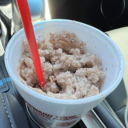 a drink in a cup with a red straw a drink in a cup with a red straw