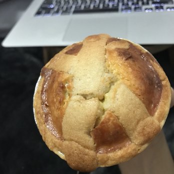 Kings Highway Bakery - a person holding a pastry in front of a laptop - Bakeries Near Me - Brooklyn, New York Kings Highway Bakery - a person holding a pastry in front of a laptop - Bakeries Near Me - Brooklyn, New York