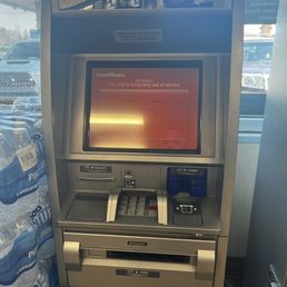 an atm machine with a red screen