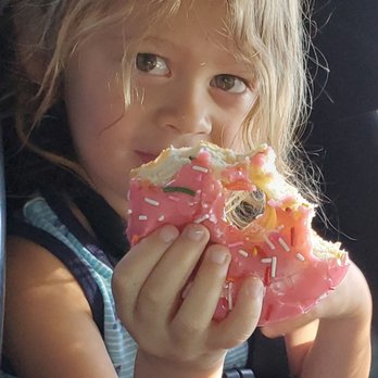Doughboys Donuts - Jj loves his pink sprinkled donut - Donuts Near Me - Reno, Nevada Doughboys Donuts - Jj loves his pink sprinkled donut - Donuts Near Me - Reno, Nevada