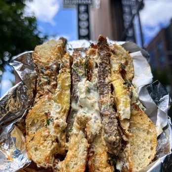 Everything Bagels - Szechuan lamb sausage everything bagel sandwich w/ lamb, scallion cream cheese, chili crisp, fried egg, and herbs (insta: @mmmashterchef) - Bagels Near Me - Durham, North Carolina