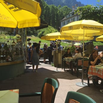 Restaurant Müller - sitting outside under the awning. You could also sit under umbrellas. - Cafes Near Me - Schwangau, BY