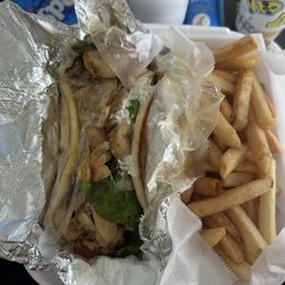 Chicken gyro (it was huge), and the meal comes with a side of crispy salted fries. So much yum in one photo. Chicken gyro (it was huge), and the meal comes with a side of crispy salted fries. So much yum in one photo.