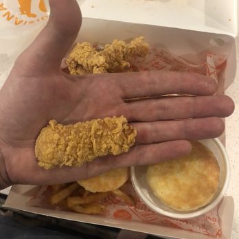 Popeyes Louisiana Kitchen - a hand holding a box of fried chicken - Fast Food Near Me - Round Rock, Texas Popeyes Louisiana Kitchen - a hand holding a box of fried chicken - Fast Food Near Me - Round Rock, Texas