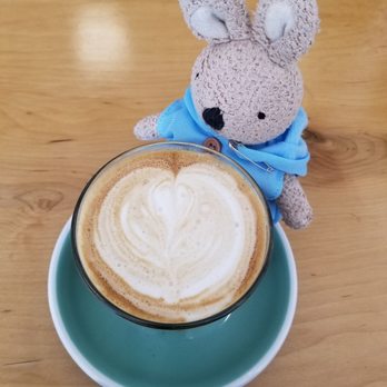 Verona Coffee - a cup of cappuccino and a stuffed animal - Coffee & Tea Near Me - Orillia, Ontario Verona Coffee - a cup of cappuccino and a stuffed animal - Coffee & Tea Near Me - Orillia, Ontario