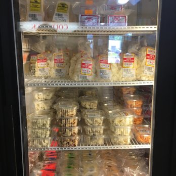 Lowville Producers Cheese Store - a display of cheeses - Cheese Shops Near Me - Lowville, New York
