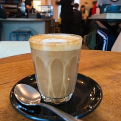 Tamper Coffee - Piccolo with a nonplussed patron