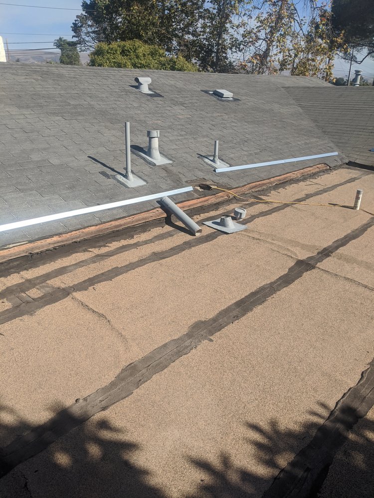 Slide of Tom's Roofing Services