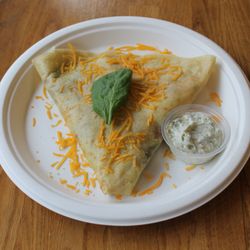 Sunrise crêpe--scrambled eggs, cheddar, spinach, and bacon