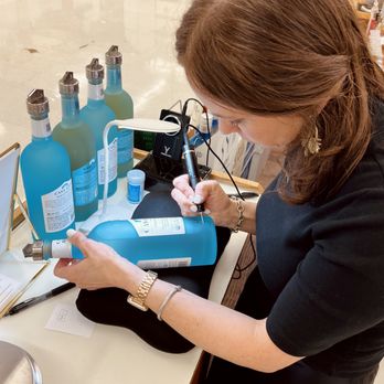 Amy Sue Designs - Live tequila bottle engraving for Casa Azul - Calligraphy Near Me Amy Sue Designs - Live tequila bottle engraving for Casa Azul - Calligraphy Near Me