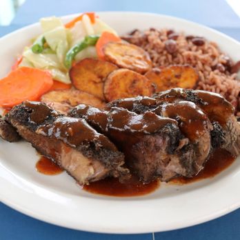 Authentic Jamaican Food - Jerk Pork with Rice and Peas, Steamed Vegetables and Fried Planatins. - Caribbean Near Me Authentic Jamaican Food - Jerk Pork with Rice and Peas, Steamed Vegetables and Fried Planatins. - Caribbean Near Me